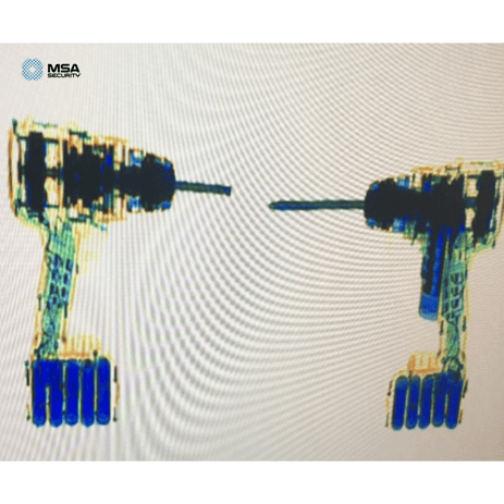 X-ray image of drills with semi automatic taped to it